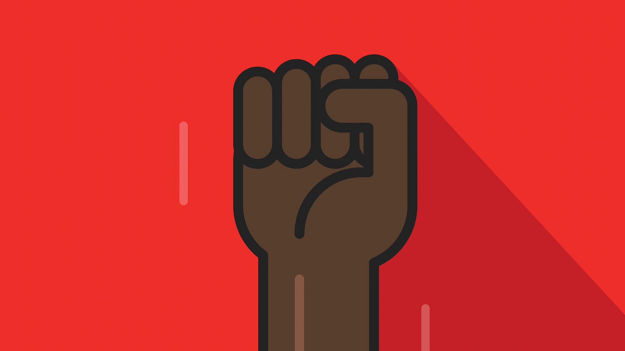 Eine schwarze Faust vor rotem Hintergrund.