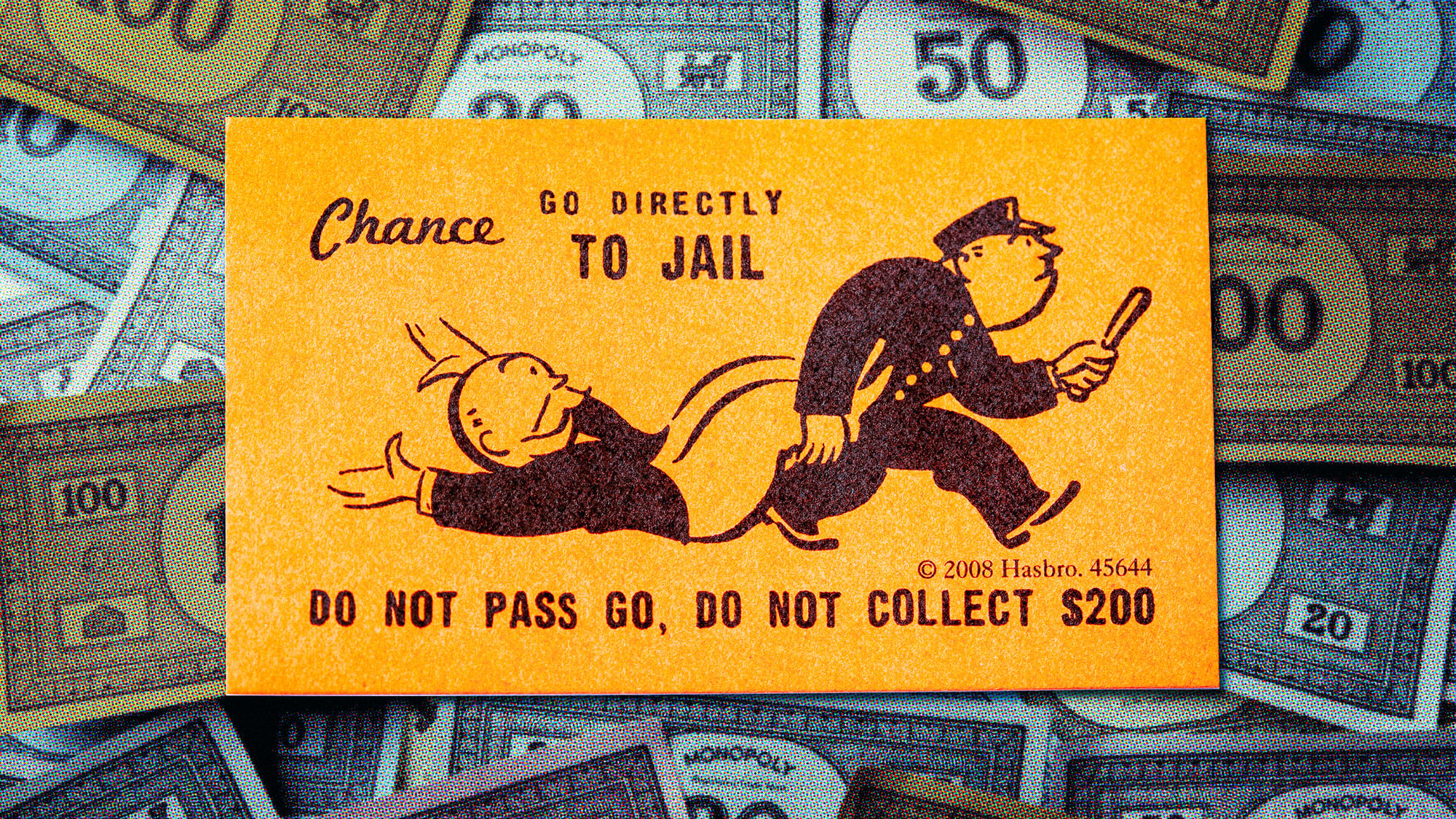 Eine „Du kommst aus dem Gefängnis frei“-Karte über Monopoly-Geldscheinen.