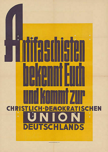 Dunkle Schrift auf gelbem Untergrund: "Antifaschisten bekennt euch und kommt zur Christlich-Demokratischen Union Deutschlands"