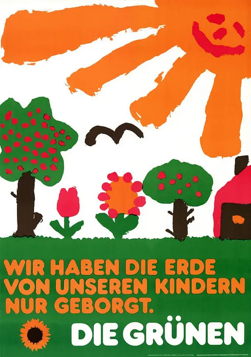 Ein buntes Plakat der Grünen, sieht aus wie von einem Kind gezeichnet, eine Sonne ist zu sehen sowie Blumen und Bäume. Dazu die Schrift "Wir haben die Erde von unseren Kindern nur geborgt."